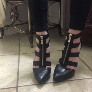Black leather cage pumps